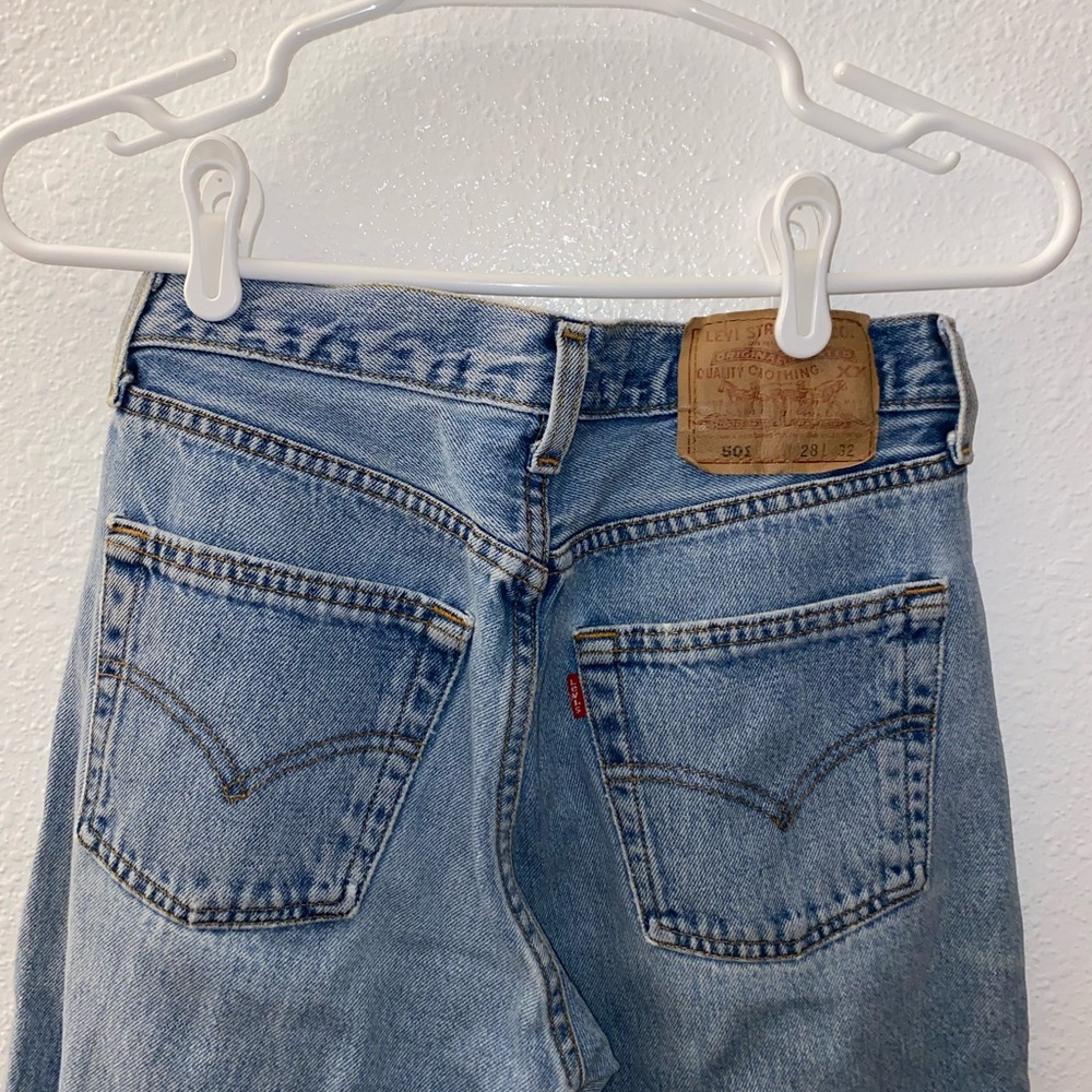Levi’s 501 with embroidered flowers on bottom of pant leg W: 28 L: 32